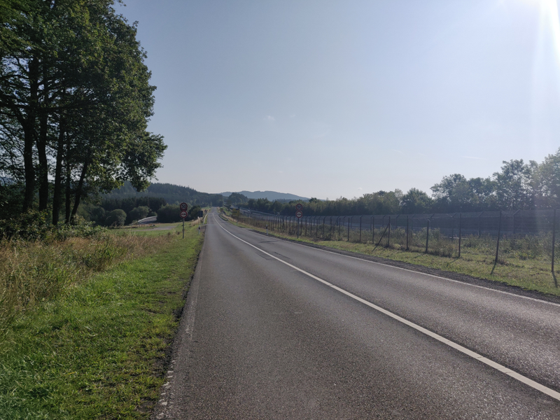 The road that runs parallel to that final straight. Visible on the right